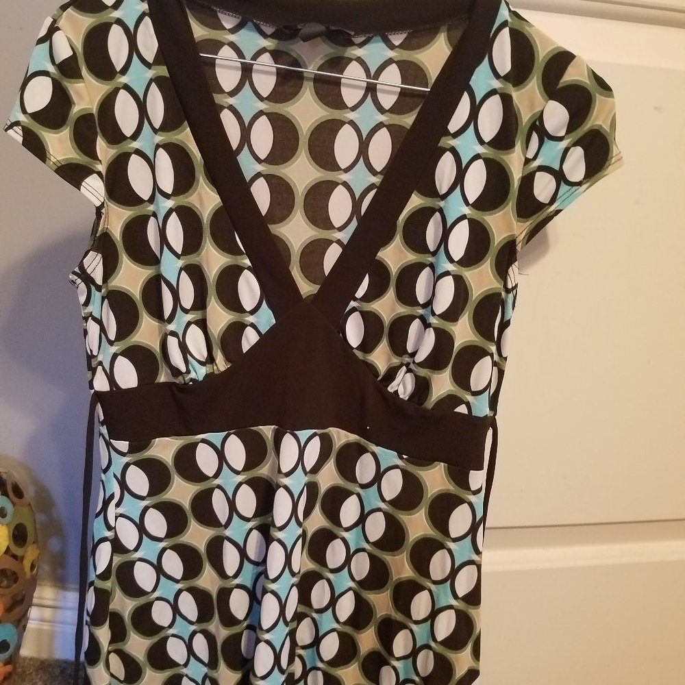 size m dress shirt, has tie in back